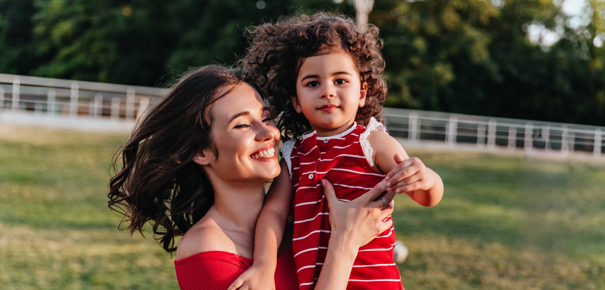 debonair-european-woman-enjoying-weekend-morning-with-little-daughter-gorgeous-young-mom-posing-park-with-curly-child (1) (1)